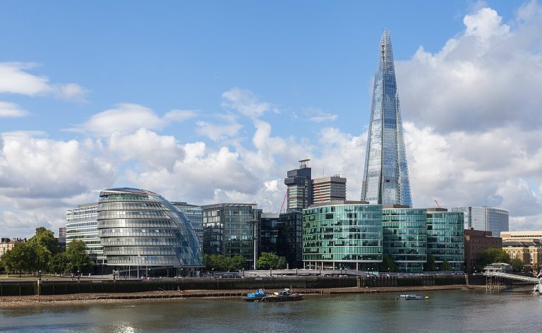 EY Breach Exposed Goldman Sachs Wealth Clients Tall glass office buildings in Canary Wharf, London
