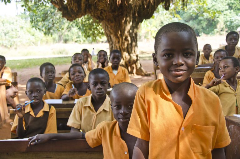 Students in a bright classroom learning without smartphones on their desks